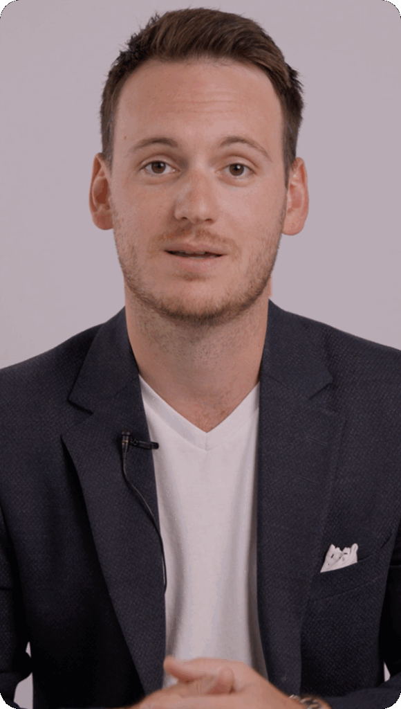 Man in suit speaking during an interview or presentation