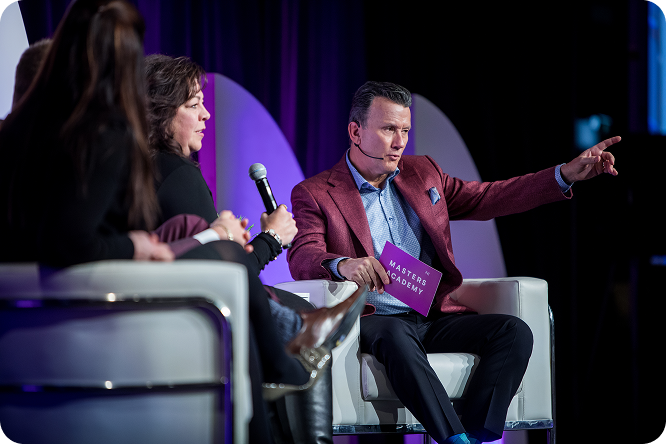 Richard Robbins speaking on stage during Masters Academy panel