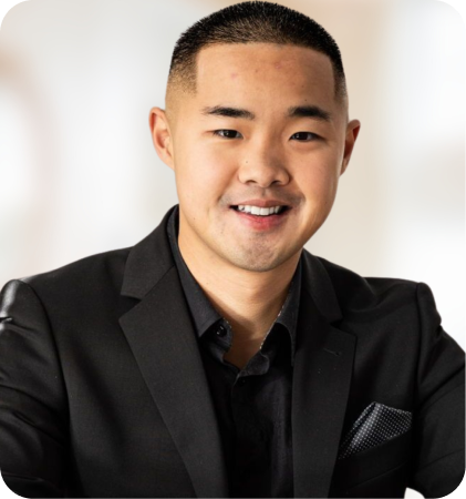 Portrait of a smiling man in a black suit